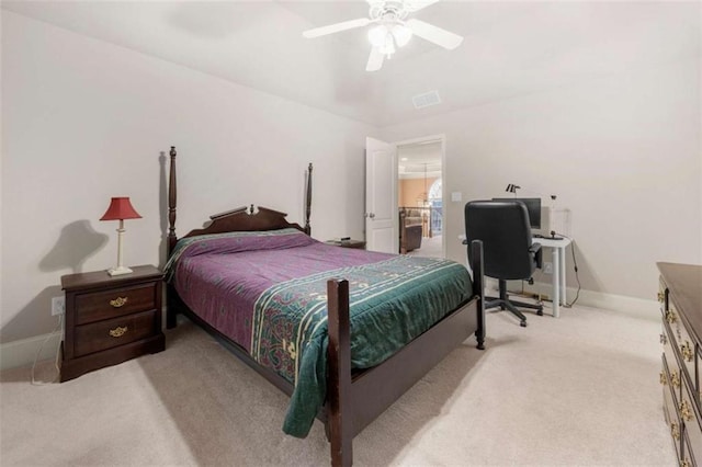 bedroom featuring baseboards, a ceiling fan, and light colored carpet