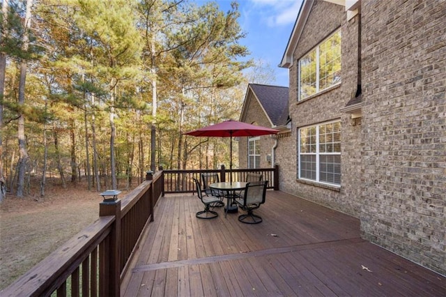 wooden deck featuring outdoor dining space