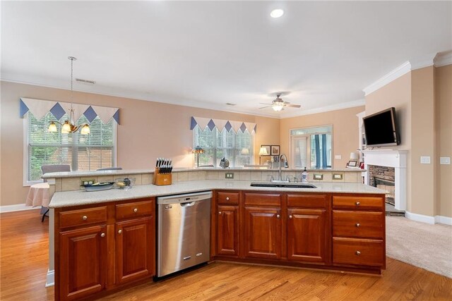 6355 Marlow Dr, Cumming, GA 30041 - kitchen with backsplash, stainless steel dishwasher, a sink, crown molding, and ceiling fan with notable chandelier