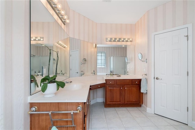 6355 Marlow Dr, Cumming, GA 30041 - bathroom with wallpapered walls, baseboards, vanity, and tile patterned flooring