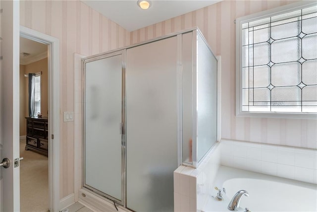6355 Marlow Dr, Cumming, GA 30041 - bathroom featuring a bath, baseboards, wallpapered walls, and a stall shower