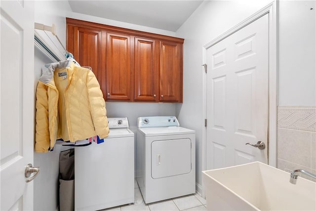 6355 Marlow Dr, Cumming, GA 30041 - laundry room featuring washing machine and clothes dryer, a sink, light tile patterned floors, and cabinet space