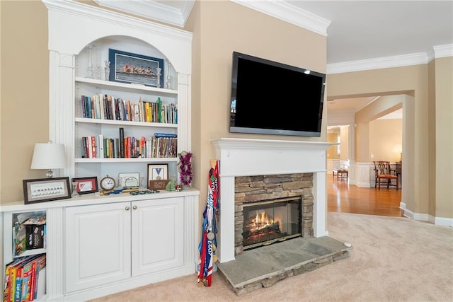 6355 Marlow Dr, Cumming, GA 30041 - carpeted living area featuring built in shelves, crown molding, and a fireplace