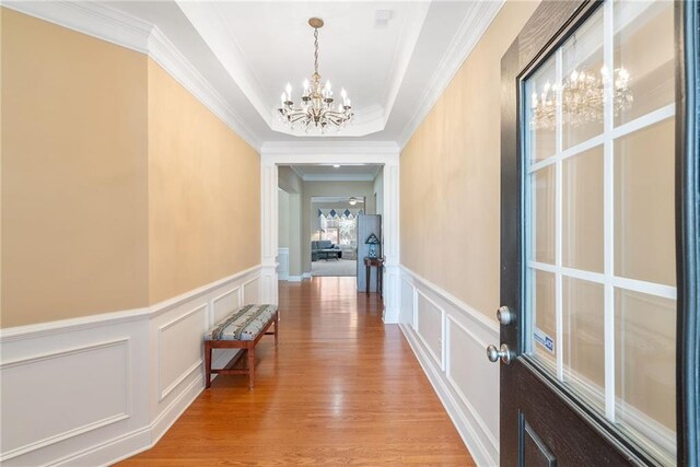 6355 Marlow Dr, Cumming, GA 30041 - hall featuring a wainscoted wall, a chandelier, ornamental molding, and a decorative wall