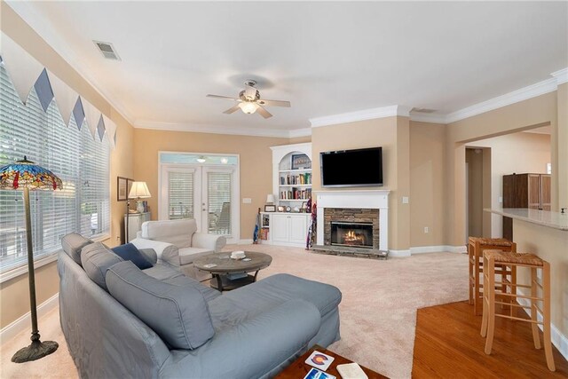 6355 Marlow Dr, Cumming, GA 30041 - living room featuring a ceiling fan, visible vents, and crown molding
