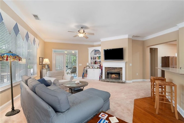 6355 Marlow Dr, Cumming, GA 30041 - living area with ornamental molding, baseboards, a ceiling fan, and visible vents