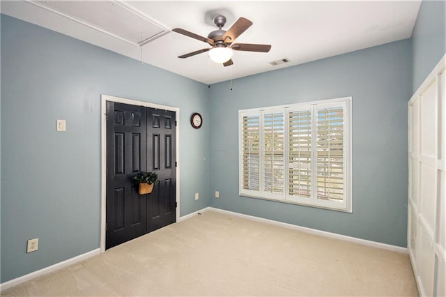 foyer featuring light colored carpet