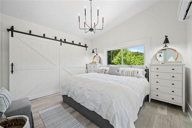 4791 Talona Rd, Talking Rock, GA 30175 - bedroom with a wall mounted AC, a barn door, light wood-style floors, vaulted ceiling, and a chandelier