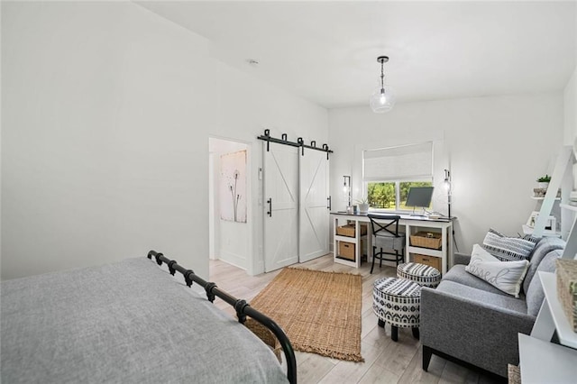 4791 Talona Rd, Talking Rock, GA 30175 - bedroom with a barn door, light wood-style floors, and a desk