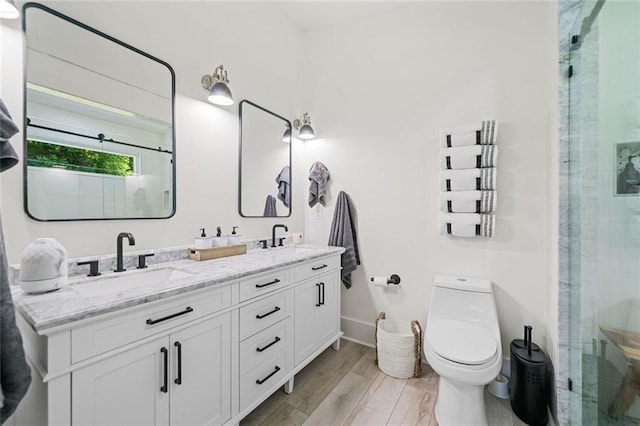 4791 Talona Rd, Talking Rock, GA 30175 - full bath featuring double vanity, toilet, a stall shower, wood finished floors, and baseboards