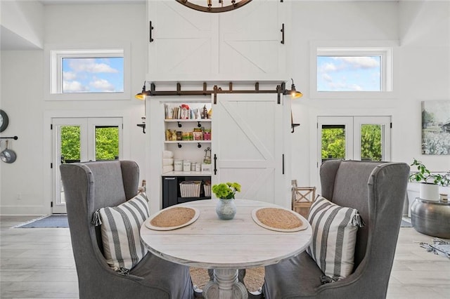 4791 Talona Rd, Talking Rock, GA 30175 - dining room featuring french doors, a towering ceiling, and a barn door