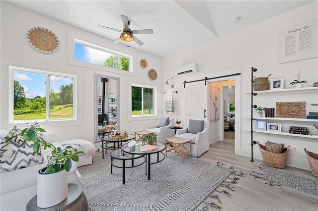 4791 Talona Rd, Talking Rock, GA 30175 - living area with a barn door, a wall mounted air conditioner, plenty of natural light, a ceiling fan, and a towering ceiling