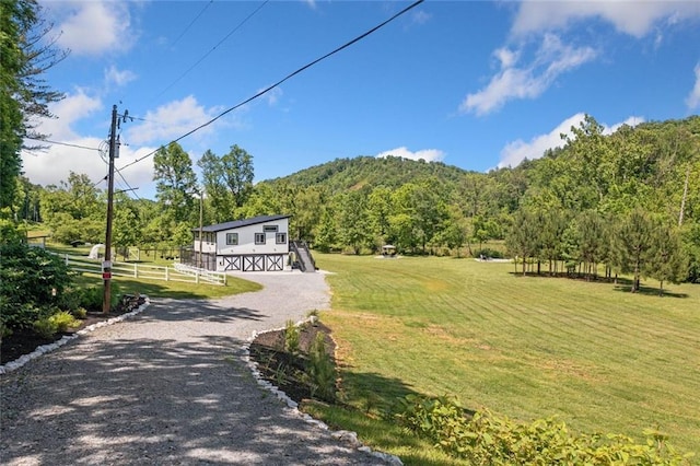 4791 Talona Rd, Talking Rock, GA 30175 - view of dirt / gravel road with a barn and a forest view