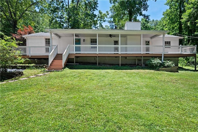 5971 Dogwood Dr SE, Acworth, GA 30102 - rear view of property featuring ceiling fan, a chimney, a lawn, and a wooden deck