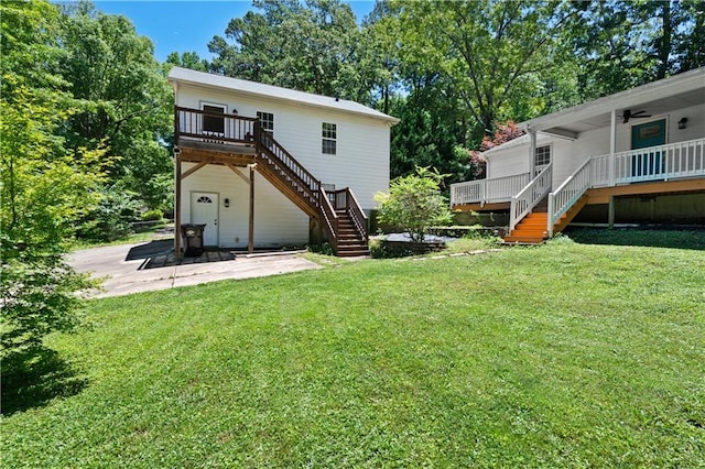 5971 Dogwood Dr SE, Acworth, GA 30102 - rear view of house featuring stairs, a wooden deck, a lawn, a patio area, and view of wooded area