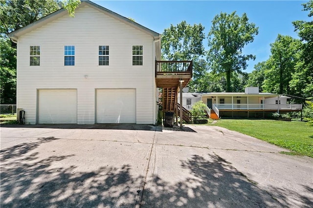 5971 Dogwood Dr SE, Acworth, GA 30102 - view of front of property featuring an attached garage, stairs, concrete driveway, and a front yard