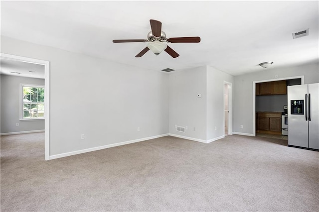 5971 Dogwood Dr SE, Acworth, GA 30102 - unfurnished living room with light colored carpet, a ceiling fan, and baseboards