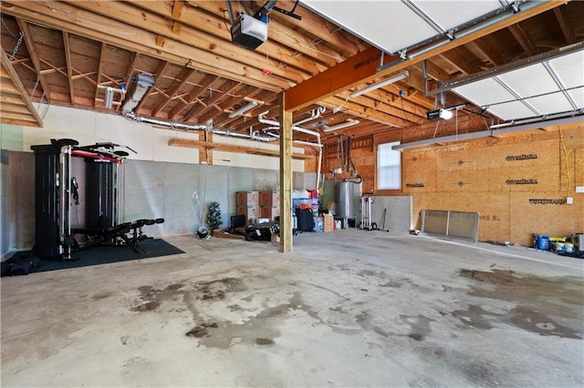 5971 Dogwood Dr SE, Acworth, GA 30102 - garage with a garage door opener and water heater