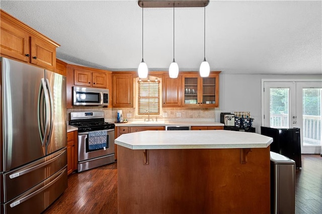 5971 Dogwood Dr SE, Acworth, GA 30102 - kitchen featuring stainless steel appliances, a sink, plenty of natural light, and light countertops