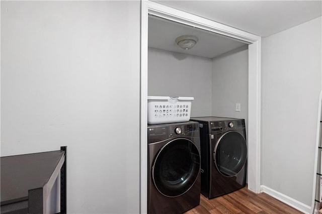 5971 Dogwood Dr SE, Acworth, GA 30102 - washroom with dark wood-style flooring, washer and dryer, and baseboards