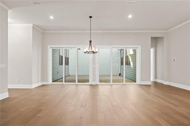 interior space with ornamental molding, a chandelier, and light hardwood / wood-style flooring