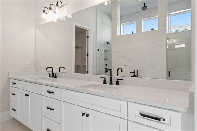 bathroom featuring vanity and walk in shower