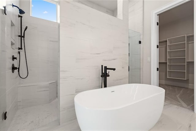 bathroom with shower with separate bathtub