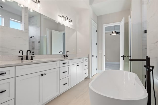 bathroom with independent shower and bath, vanity, and ceiling fan