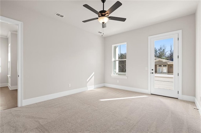 empty room with ceiling fan and light colored carpet