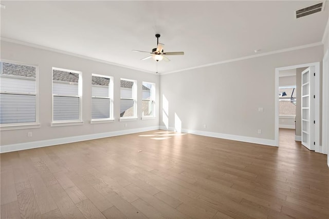 unfurnished room with crown molding, ceiling fan, and hardwood / wood-style flooring