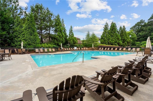 view of swimming pool with a patio