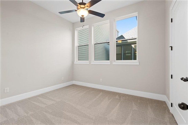 unfurnished room featuring light carpet and ceiling fan