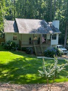 view of front of house with a front lawn and a porch