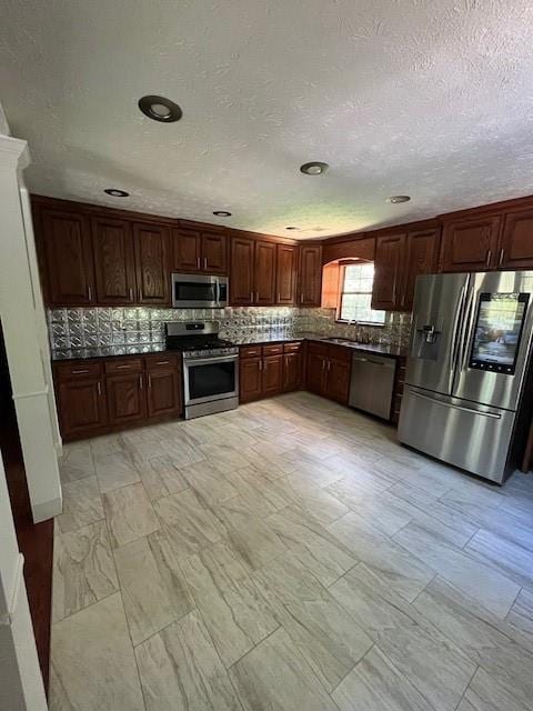 kitchen with sink and appliances with stainless steel finishes