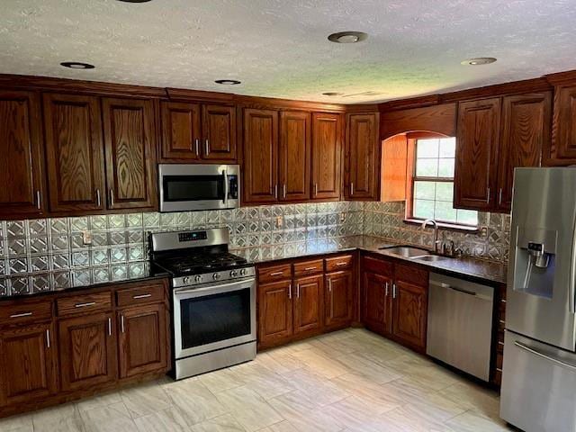 kitchen with appliances with stainless steel finishes and sink