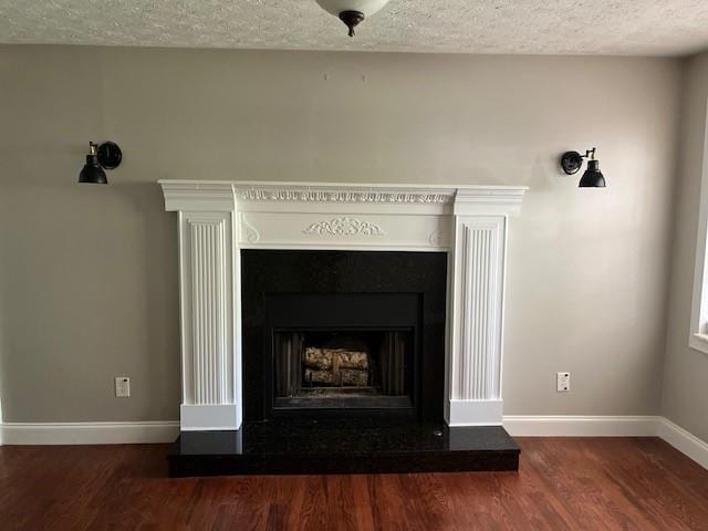 room details featuring wood-type flooring and a textured ceiling