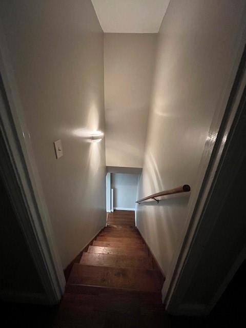 stairway featuring hardwood / wood-style floors