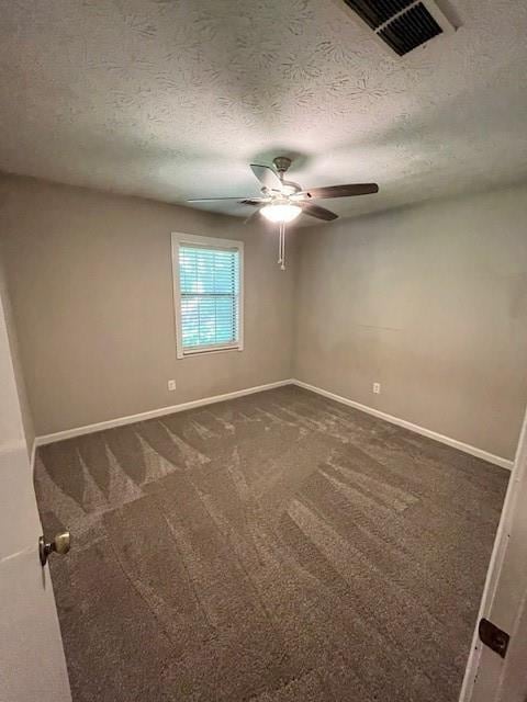 carpeted empty room featuring a textured ceiling and ceiling fan