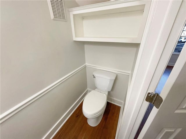 bathroom featuring toilet and hardwood / wood-style floors