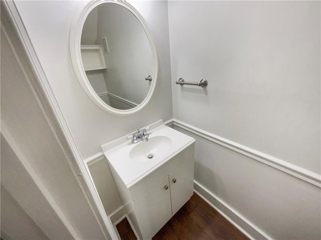 bathroom with vanity and hardwood / wood-style flooring