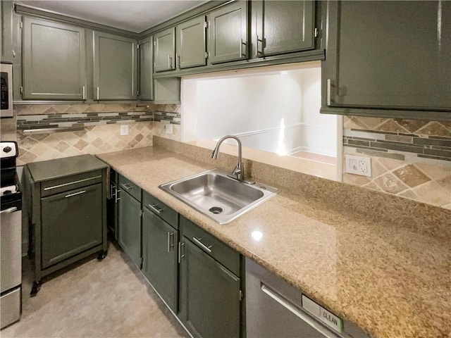 kitchen with stainless steel range with electric stovetop, sink, backsplash, and green cabinetry