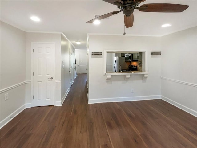 interior space featuring crown molding, dark wood-type flooring, and ceiling fan