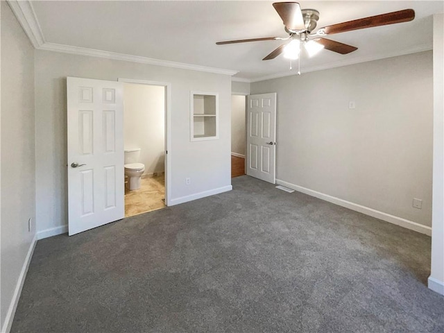 unfurnished bedroom featuring crown molding, connected bathroom, ceiling fan, and dark carpet