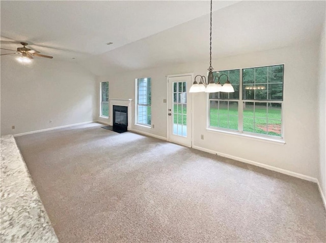 46 Timber Walk Dr, Sharpsburg, GA 30277 - unfurnished living room with lofted ceiling, a ceiling fan, a fireplace with flush hearth, and carpet flooring