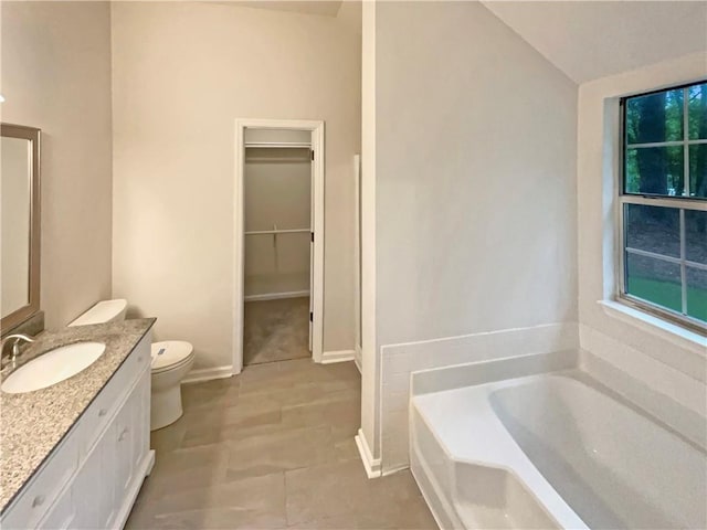 46 Timber Walk Dr, Sharpsburg, GA 30277 - full bathroom featuring vanity, a garden tub, a spacious closet, lofted ceiling, and tile patterned flooring