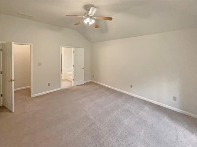 46 Timber Walk Dr, Sharpsburg, GA 30277 - unfurnished bedroom featuring lofted ceiling, carpet, connected bathroom, and a ceiling fan