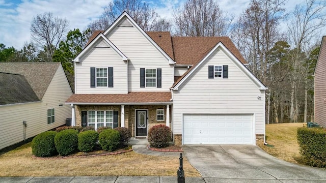 view of front property with a garage and a front lawn