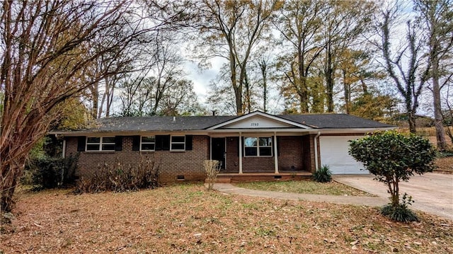 ranch-style house with covered porch and a garage