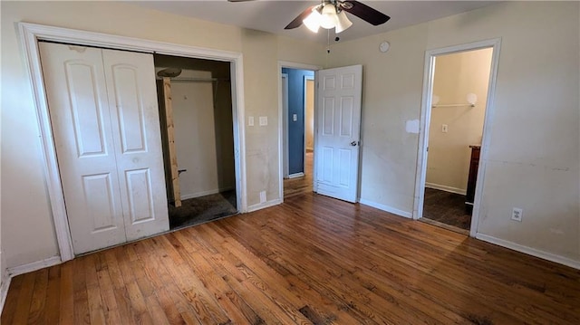 unfurnished bedroom featuring ceiling fan, dark wood-type flooring, and a closet