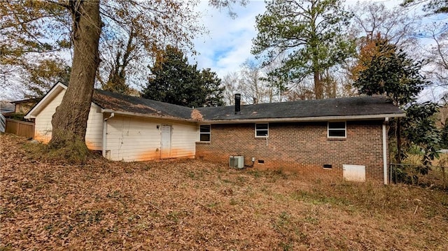 rear view of property with central AC unit